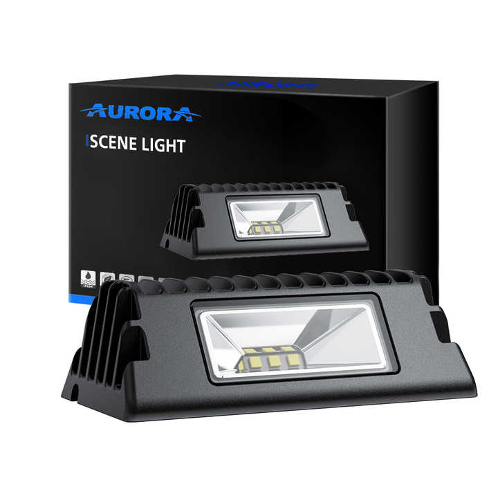 Aurora compact LED scene light — scene light beside its retail box