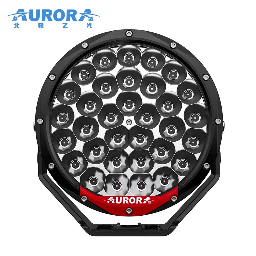 Aurora 7-inch high-lux driving lights — front product view with red Aurora accent